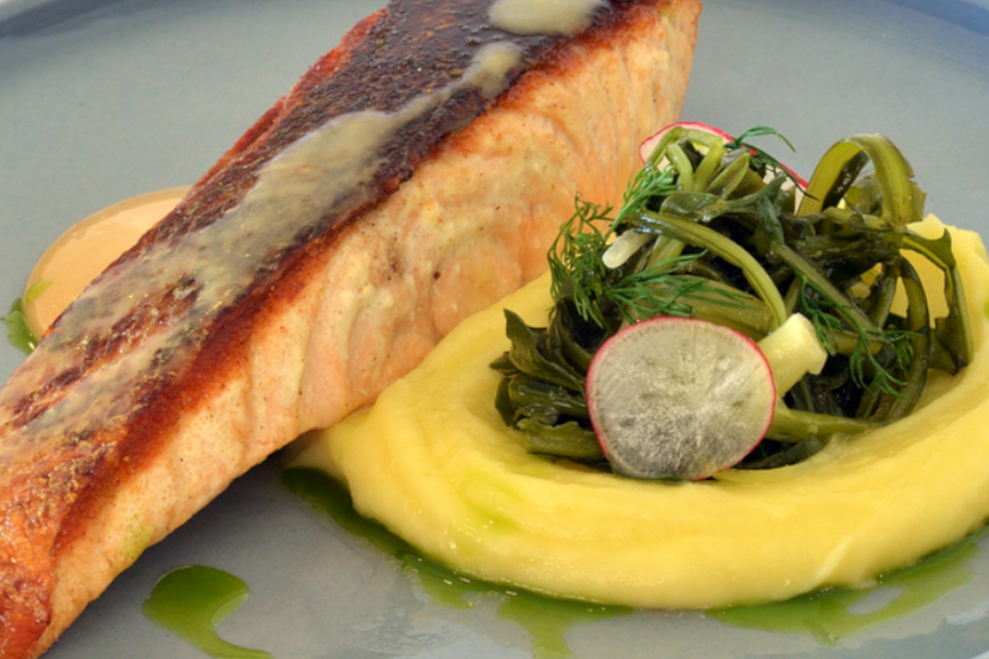 Salmon fillet with Cretan greens, potatoes puree, miso sauce & truffle vinaigrette