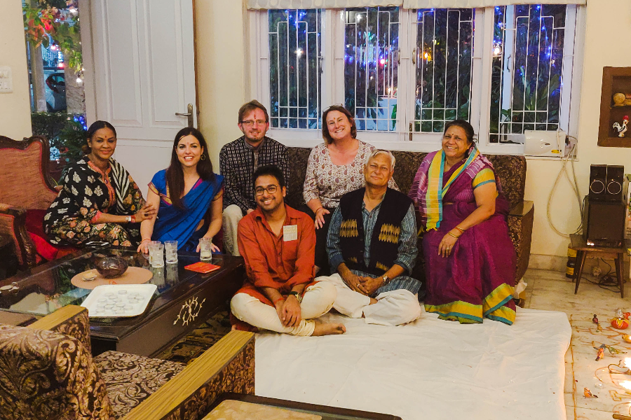We invite our guests not just to our homestay but also into our family. Guests celebrating Diwali with us and joining in for a festival meal. - ©Prakash Kutir B&B