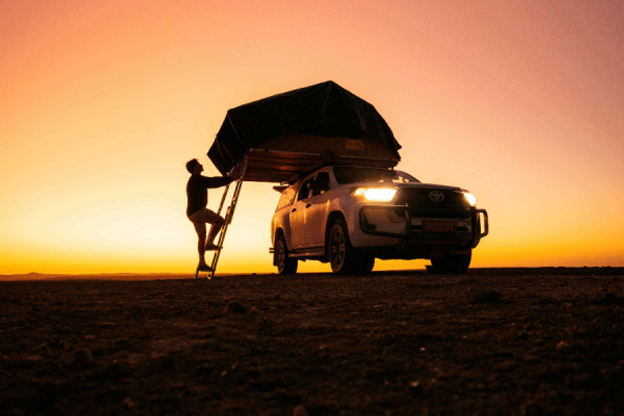 Pitching the rooftop tent at the end of the day - ©D Rupping
