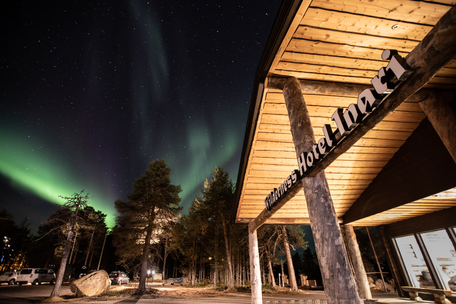 Wilderness Hotel Inari main building under the northern lights - ©Wilderness Hotel Inari