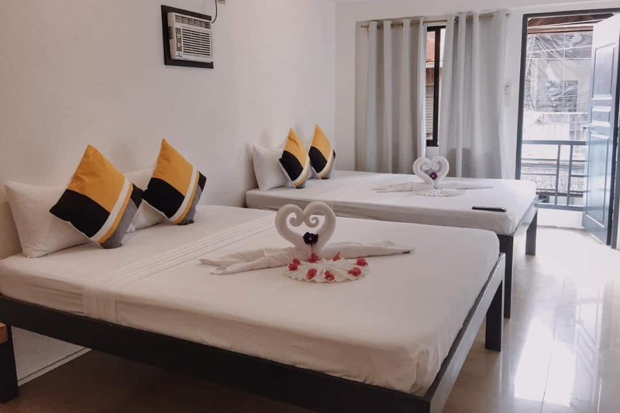 PALMERA EL NIDO INN