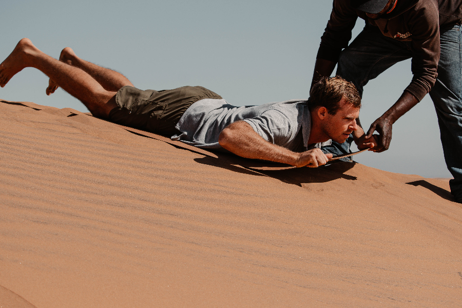 We'll show you the best way to experience what Namibia has to offer. Enjoy our lie-down sandboarding. - ©Desert Explorers